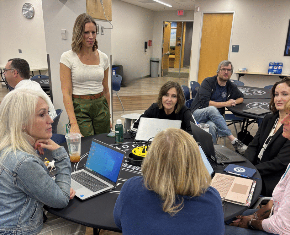 Group of educators at a table during a learning session.
